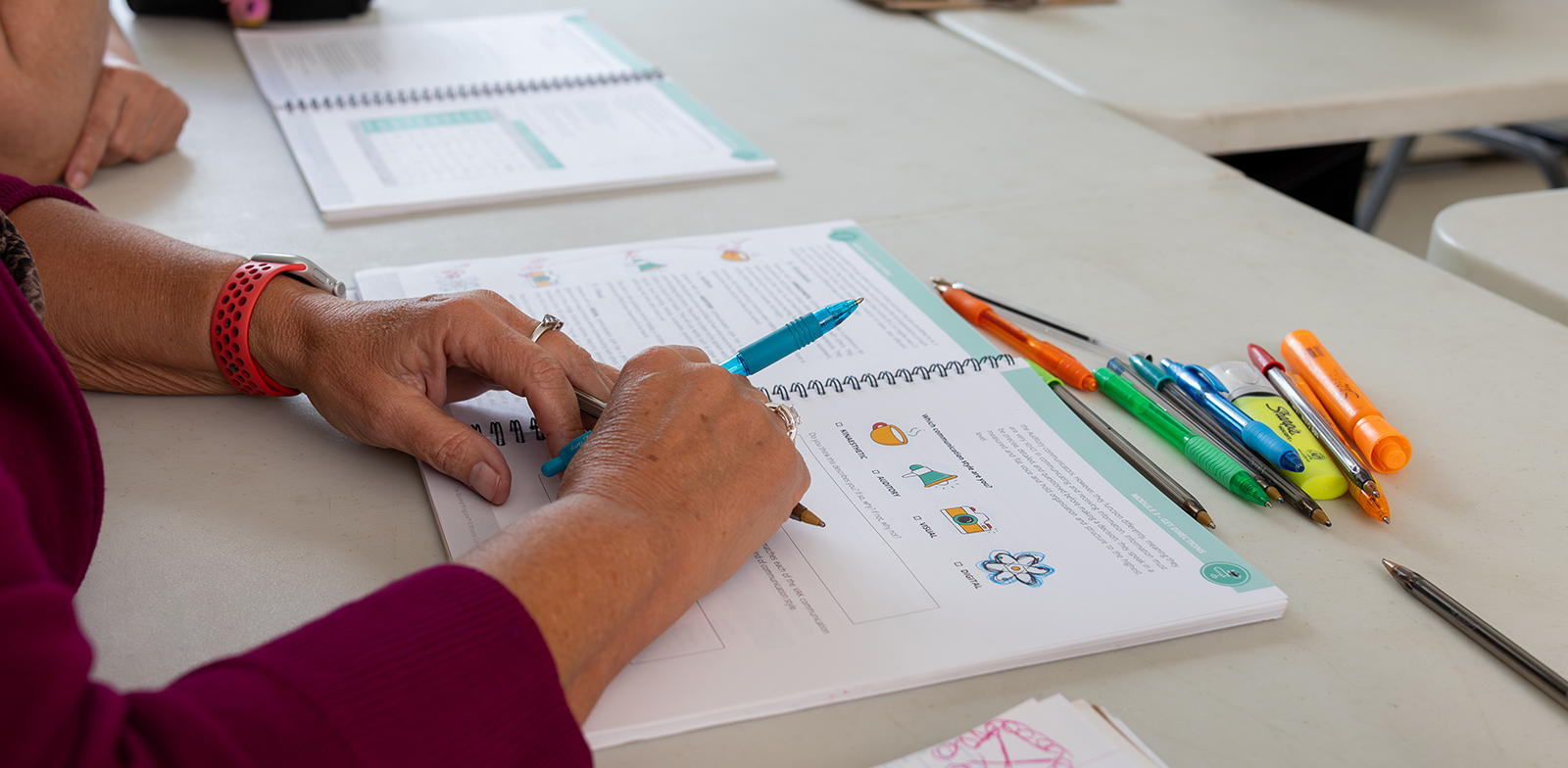 Senior Connection in Central MA - Workforce Training - Person taking notes in a notebook